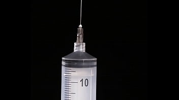 Play Making of fake tits: filling of expander silicone breast implant with saline into twice its prescribed size